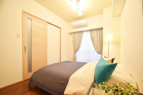 Una cama o camas en una habitación de レーヴK502