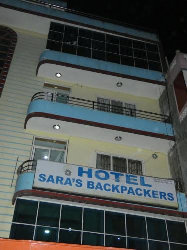 a hotel sign on the side of a building at Sara's Backpackers Hotel in Kathmandu