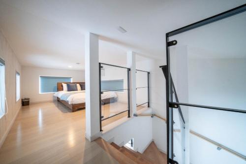 Una cama o camas en una habitación de THE LUNA LOUNGE