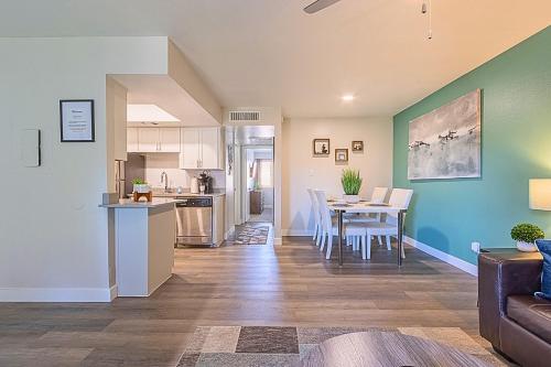 a kitchen and living room with a table and chairs at 2BR near Stone Creek - Pool & Mall Access Comfort - C254 in Phoenix