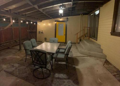 a group of chairs around a table in a garage at PlanetView Delux Richmond XL- walk Best MexFood in Richmond