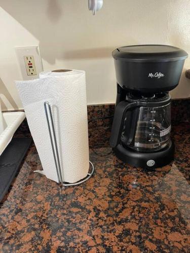 a coffee pot and paper towels on a counter at PlanetView Delux Richmond XL- walk Best MexFood in Richmond