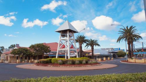 a clock tower in the middle of a street at Motel Myall in Dalby