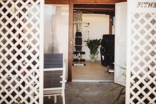 a room with a gym with a treadmill and stairs at Alloggi Turistici con Piscina Palestra Jacuzzi Sauna - All Inclusive in Anzio