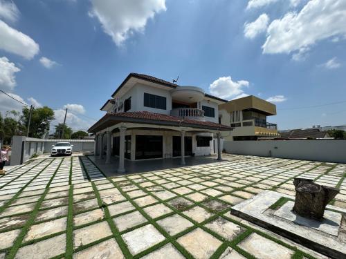 a house sitting on top of a roof at Happy Homestay in Ipoh