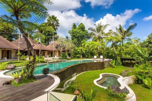 an exterior view of a villa with a swimming pool at Jungle Villa! Breath-taking views & near Ubud! in Penginyahan