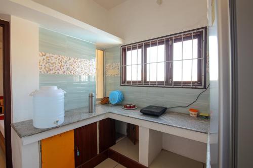 Kuchyň nebo kuchyňský kout v ubytování Manora Residency