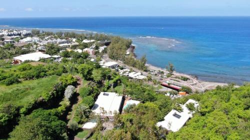 an aerial view of a beach with a roller coaster at Lodge Nature in Saint-Leu