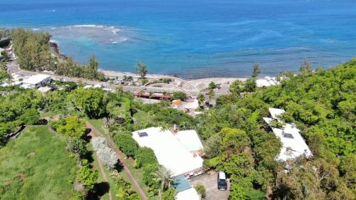 an aerial view of a beach and a bridge at Lodge Nature in Saint-Leu