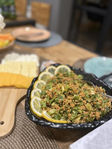 a dish of food in a pan on a table at Arevaham Boutique Hotel in Stepʼanavan