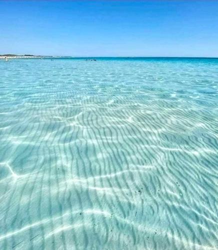 a large body of water with ripples in it at casetta nel salento in Racale