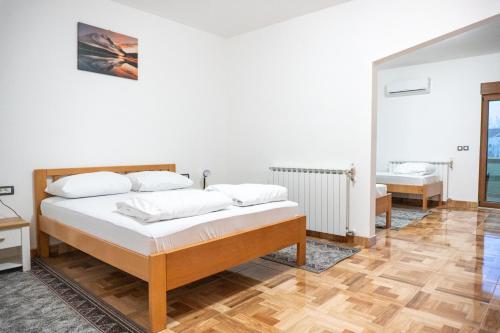 a bedroom with two beds in a room at Hotel Europa in Zagreb