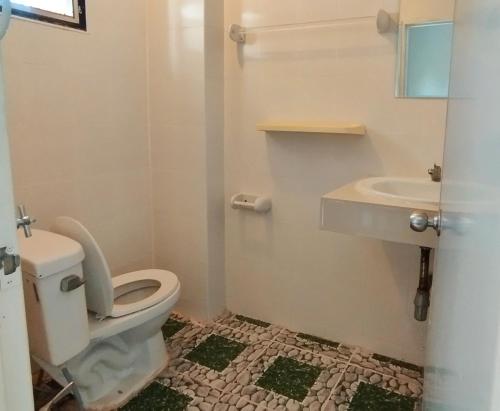 a bathroom with a toilet and a sink at ALPHA Hostel Cafe&Bar in Ban Khlong Yai