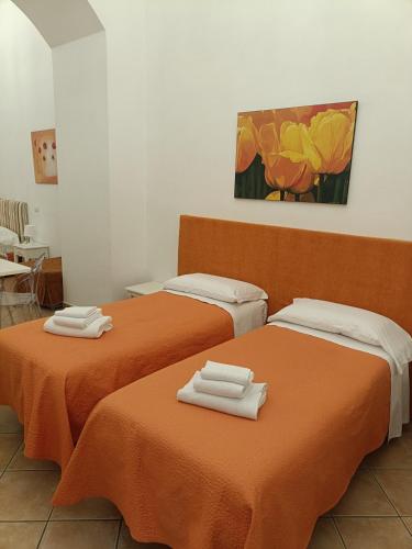 Ένα ή περισσότερα κρεβάτια σε δωμάτιο στο Casa Sorrentina