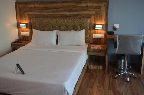 Cama ou camas em um quarto em Hotel Godrej Avenue VFS Global