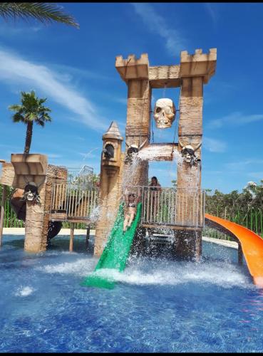 a water slide at a water park at LOGIS Hôtel La Chaumière in Marseillan