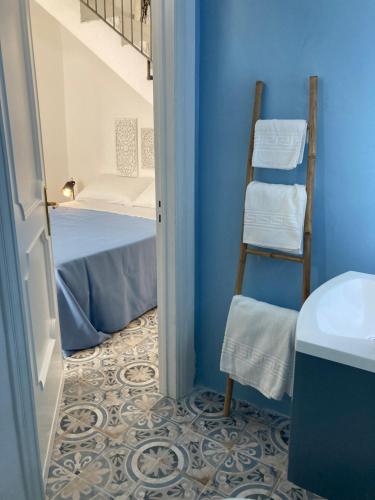a room with a staircase leading to a bunk bed at B&B Antica Dimora dell'Angelo in Nardò