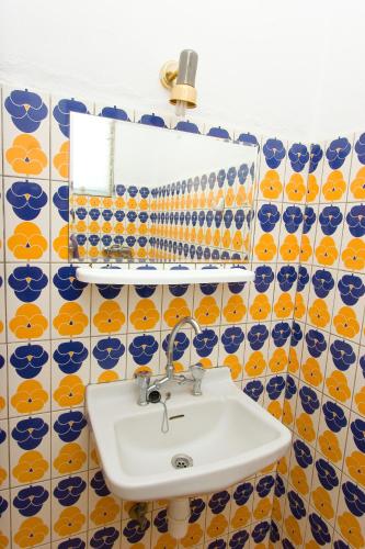 a bathroom with a sink and a mirror at Malamatenia Studios in Loutra Edipsou