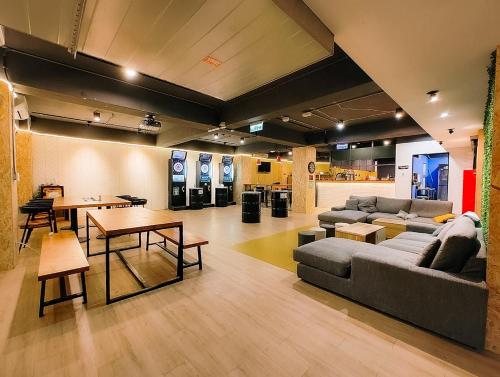 a living room with a couch and a table at Meeting Mates Hostel in Taipei