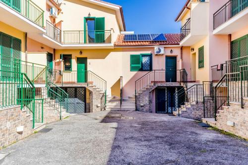 an alleyway between two buildings with stairs at Nepi green apartment in Nepi