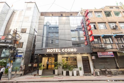 a hotel cosmopolis on a city street at Hotel Cosmo Near BLK Hospital Karol Bagh in New Delhi