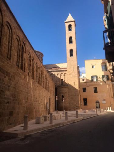 a large brick building with a clock tower at I Venti in Taranto