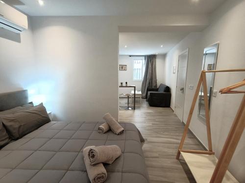 a small bedroom with a bed and a staircase at Marbella-Peñuelas Old Town Apartments in Marbella