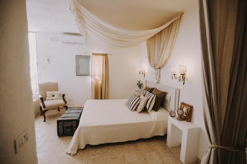 Un pat sau paturi într-o cameră la Masseria La Macina