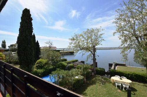 a balcony with a view of a river and a bridge at Villa Fortuna in Palazzo Vianello