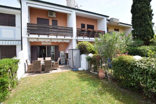 a house with a patio and a yard at Villa Fortuna in Palazzo Vianello