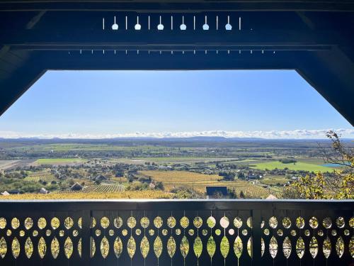 a view from the balcony of a house with a view of the countryside at Somlo Wineshop Guesthouse in Somlóvásárhely