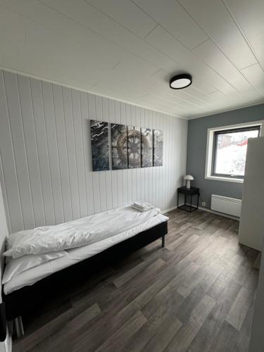 Postel nebo postele na pokoji v ubytování Arctic Sea Breeze