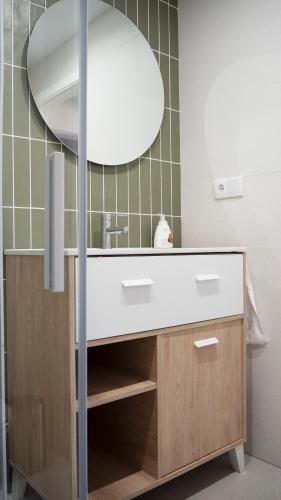 a bathroom with a sink and a mirror at La Higuera ATCC00793 in Trujillo