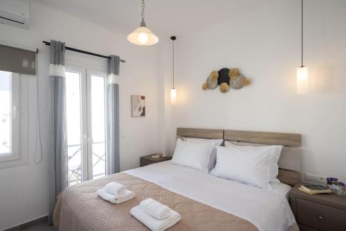 Кровать или кровати в номере My White Studio Mykono Town