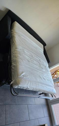 a mattress is wrapped in plastic in a room at Studio au coeur de l'Esterel à Théoule-sur-Mer in Théoule-sur-Mer