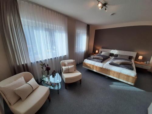 Postel nebo postele na pokoji v ubytování Ferienwohnung am Kapellenberg - am Rande des Nationalparks Schwarzwald