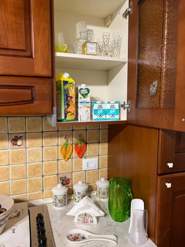 a kitchen with a counter top with a counter top at Casa Belvedere Motta Camastra Gole Alcantara in Motta Camastra