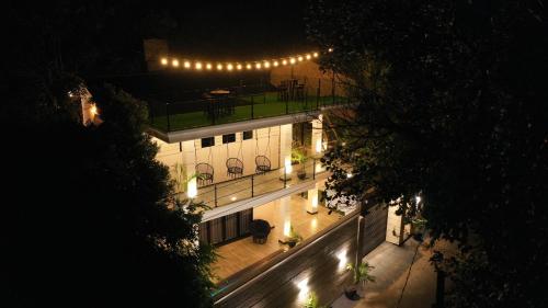 an overhead view of a building at night with lights at The Castle By Scenic Weligama in Weligama