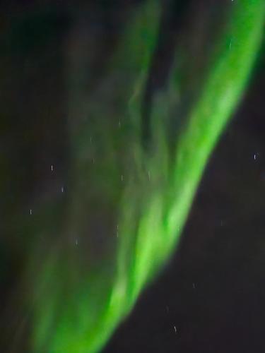 an image of the northern lights in the sky at Lund - Exellent Apartment in Tromsø