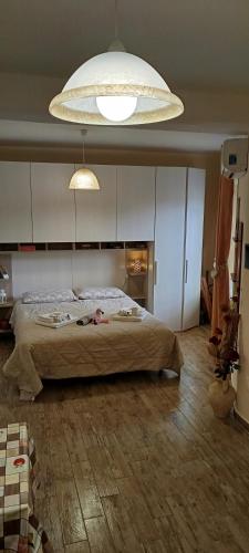a woman laying on a bed in a bedroom at Casa Il Nido in Cagliari