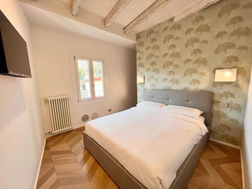 Postel nebo postele na pokoji v ubytování LaMeCa Bergamo