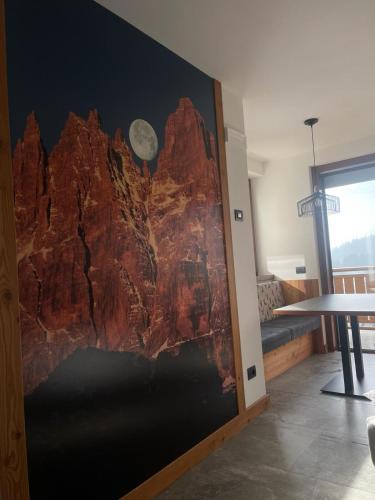 a wall with a mural of a mountain at Al Marchior in Andalo