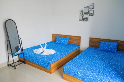מיטה או מיטות בחדר ב-HOTEL Hiếu Sang 68 Bến Tàu RẠCH GIÁ