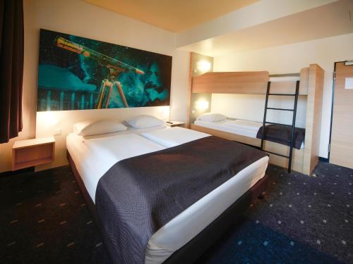 Voodi või voodid majutusasutuse B&B Hotel Jena toas