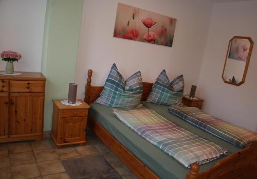 Ένα ή περισσότερα κρεβάτια σε δωμάτιο στο Moselblick - Ferienwohnung an der Uferpromenade