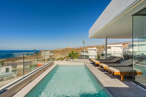 a swimming pool on the roof of a house at Villa Ametza in Callao Salvaje