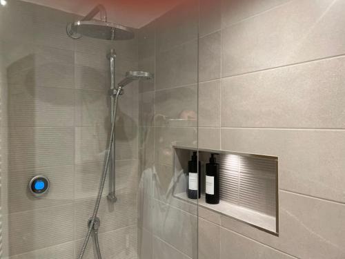 a shower with a glass door in a bathroom at Beautiful Baslow Bolthole (close to Chatsworth) in Baslow