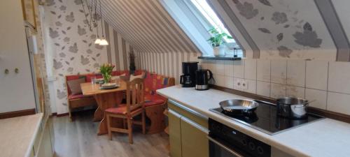 a kitchen with a stove and a counter top at Ferienwohnung Landmann in Winsen Aller