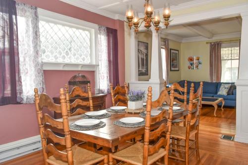 a dining room with a table and chairs at Walk To Parks, Dining & Lake! Game Room! Hot Tub! in Watkins Glen