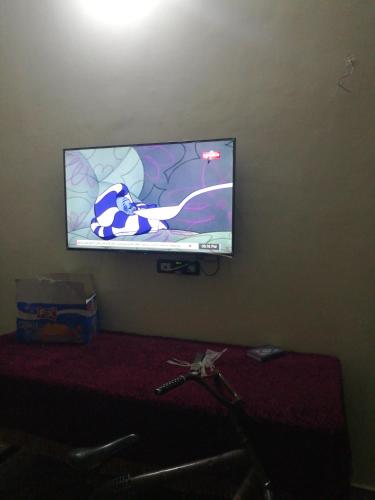 a flat screen tv hanging on a wall at Small apartment in Egypt luxor West Bank without Home Home furnishings in ‘Ezbet Abu Ḥabashi